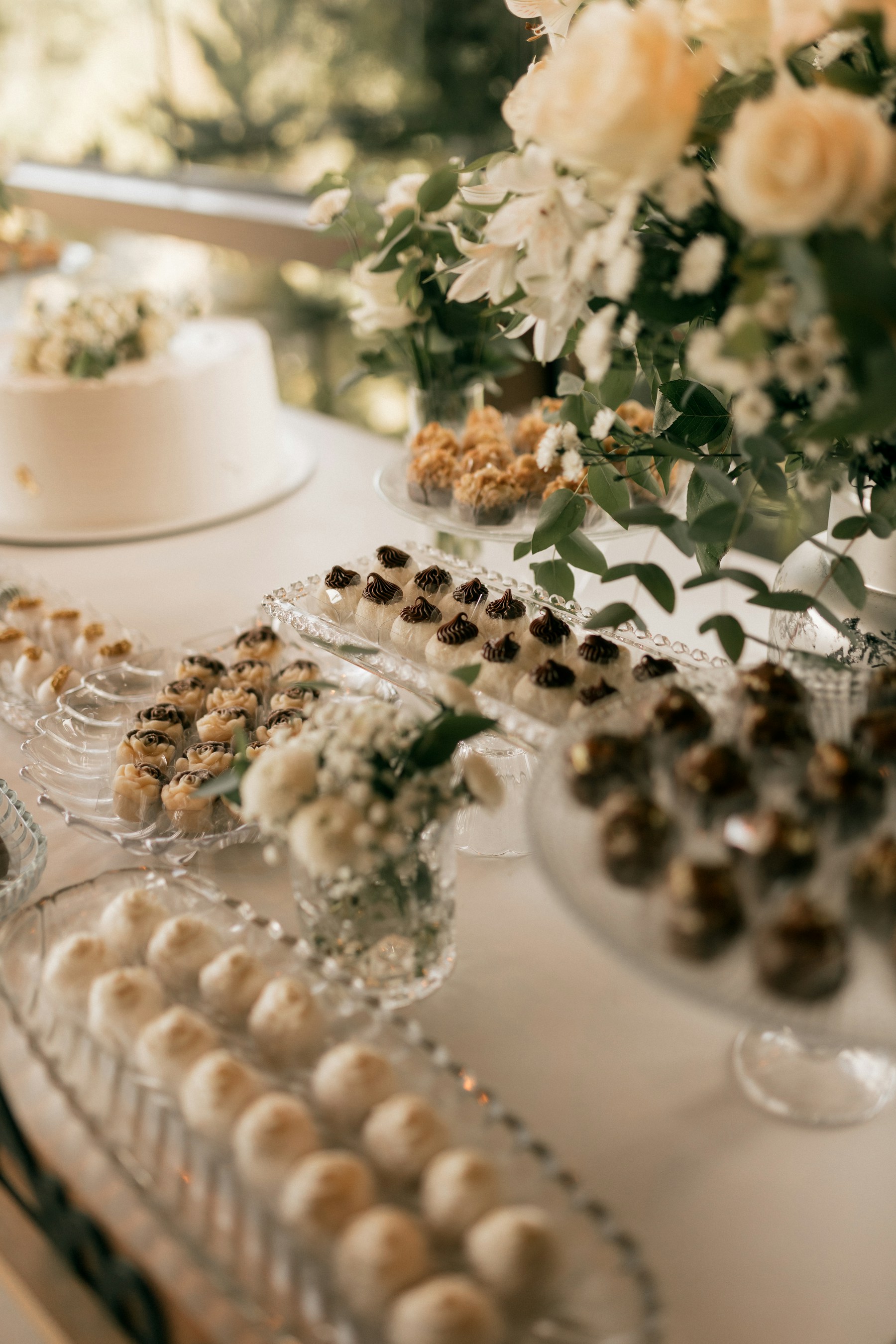 Dessert table with cake, cookies and chocolates