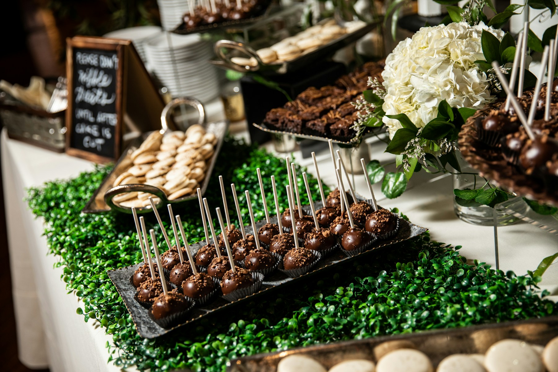 Long dessert table with party sweets